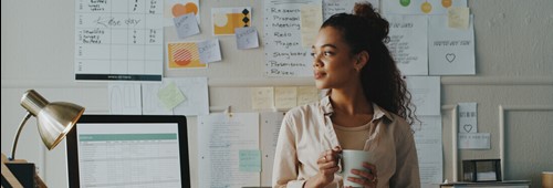 businesswoman standing and looking contemplative