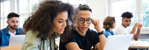 woman discussing with man in classroom